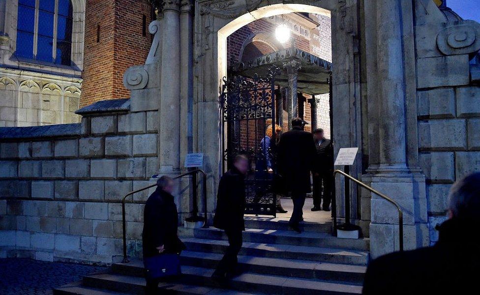 Members of exhumation team enter crypt at the Wawel Cathedral in Krakow, Poland, 14 November 2016