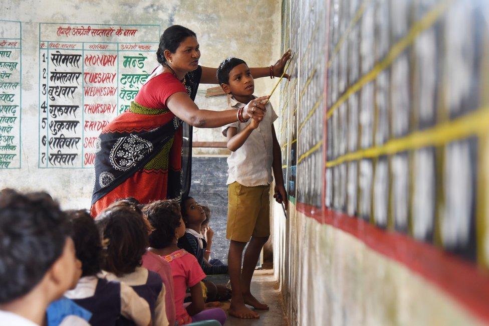 A teacher with one of her students.