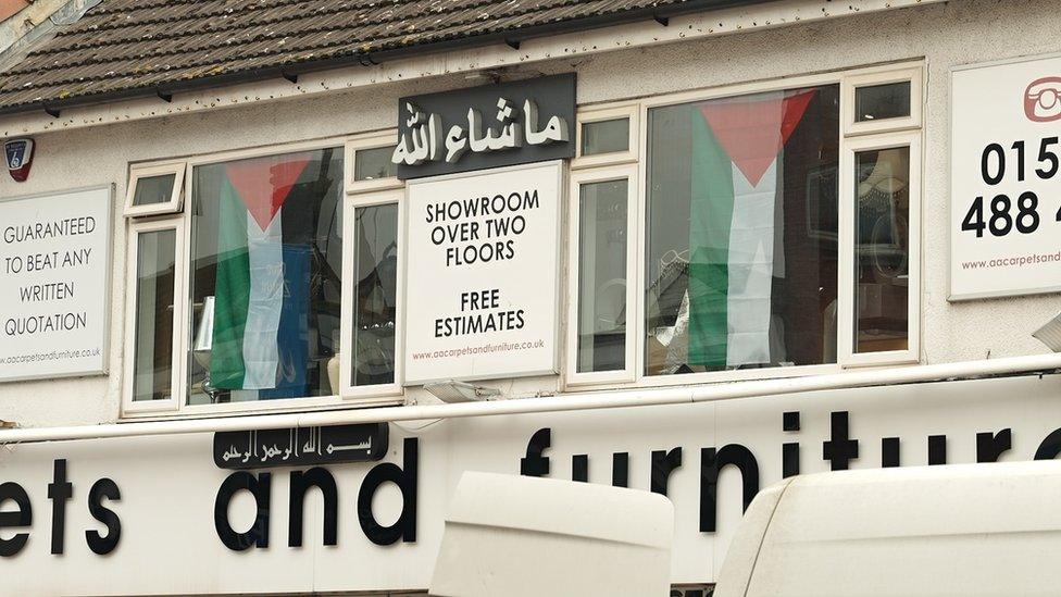 Palestinian flags draped in a Luton shop window