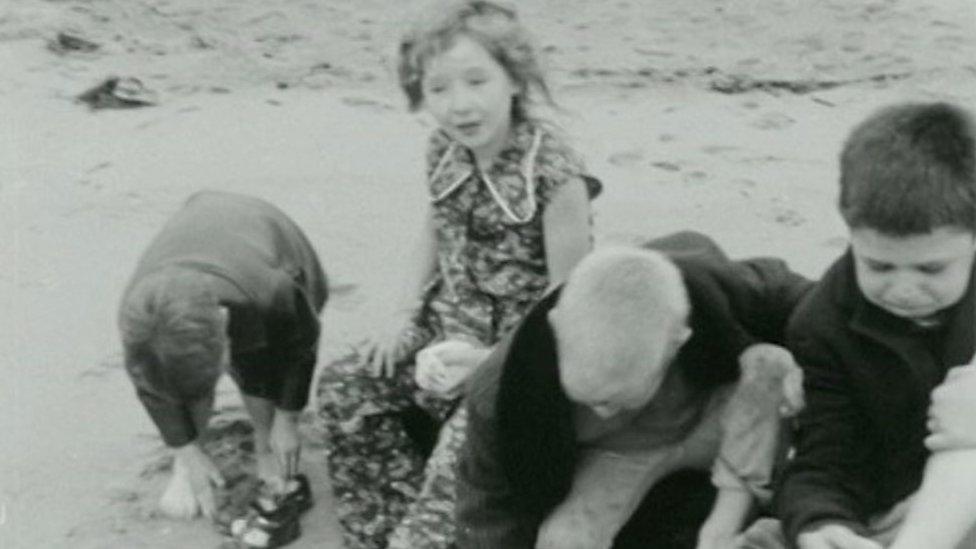 Archive footage of children in 1960s