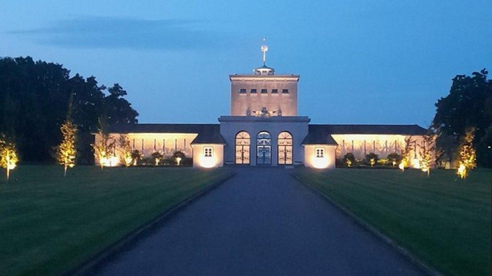 The memorial lit up at night