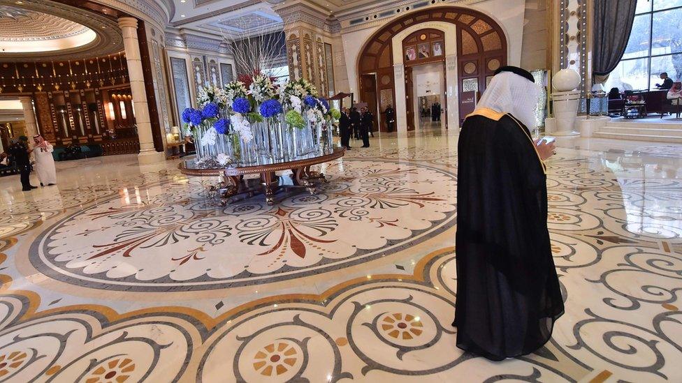 A man walks in the lobby of the Ritz Carlton hotel in Riyadh