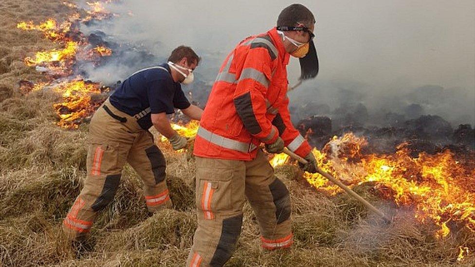 Firefighters tackling a blaze at Lyme Park