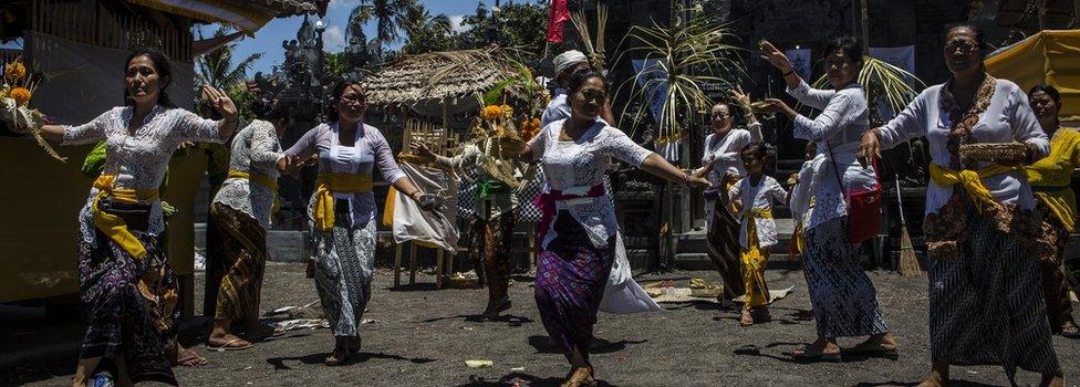 Balinese Hindu worshipers perform ritual ceremony inside danger zones in Kubu village, on 25 September 2017 in Karangasem regency, Island of Bali, Indonesia