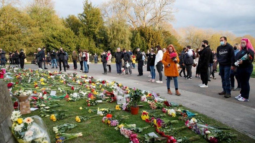 People gather outside Windsor Castle after Prince Philip's death