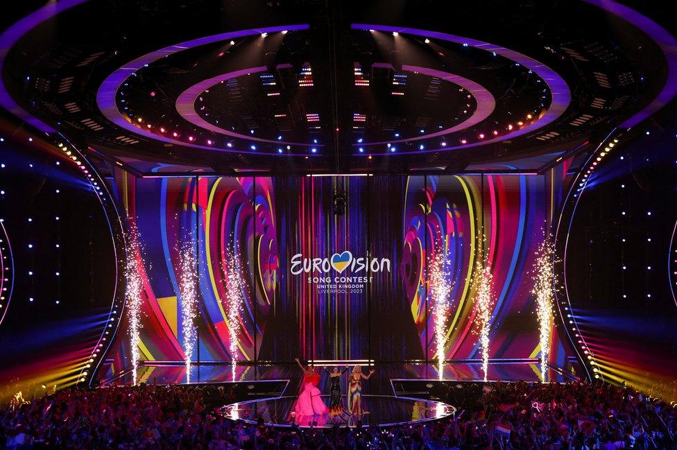 The Eurovision stage in Liverpool showing rainbow coloured lights and the event logo