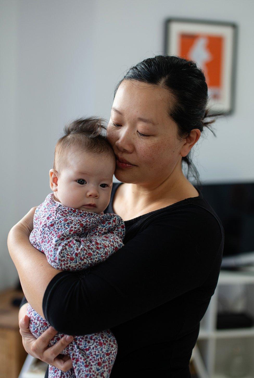 A portrait of Amy with her baby daughter Elowen