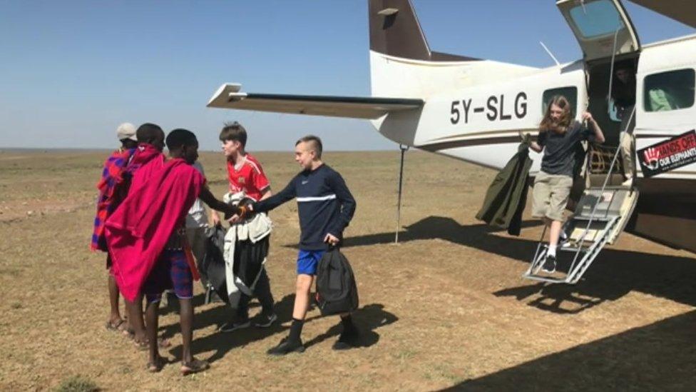 Kids getting off plane in Kenya