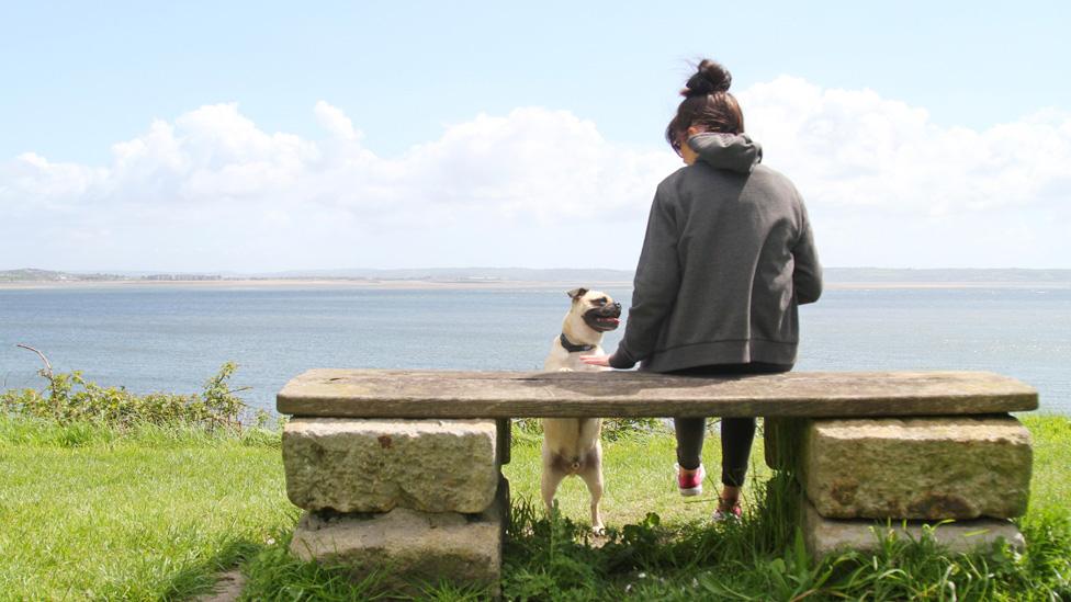 Woman on Welsh coast