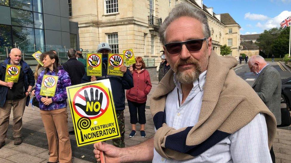 Protesters gathered with placards outside the County Hall ahead of the meeting