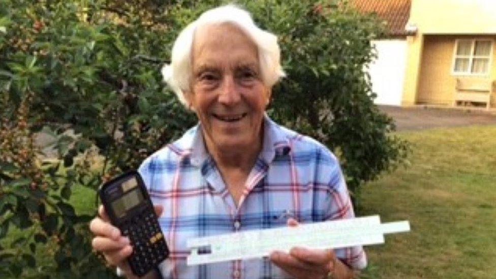 Derek Skipper with calculator and slide rule