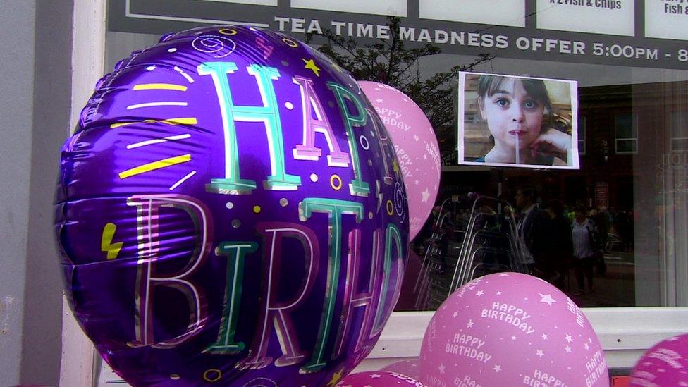 Balloons outside her family business