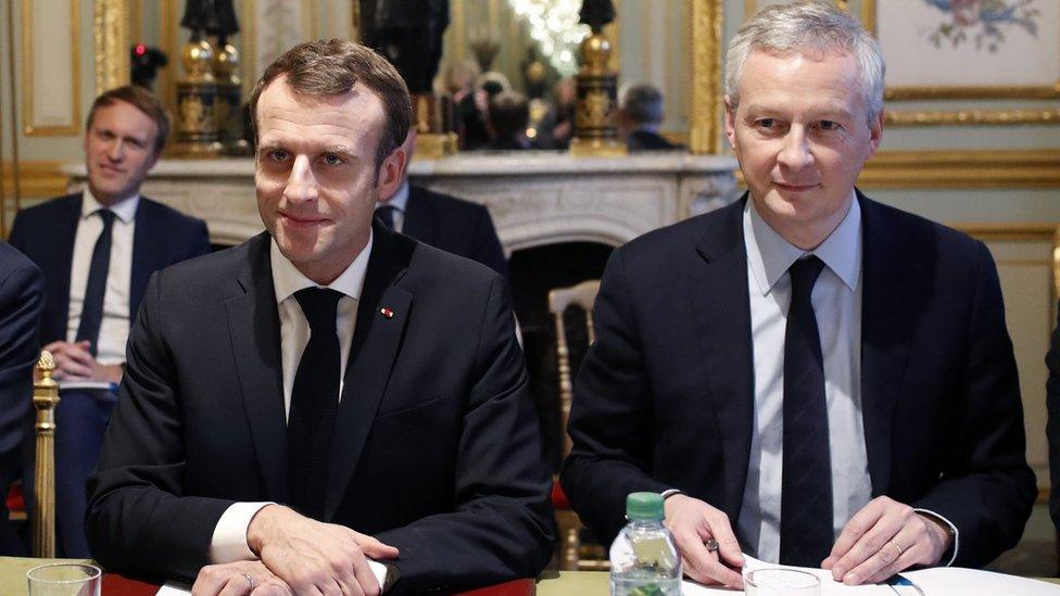 President Emmanuel Macron with Finance Minister Bruno Le Maire on 11 December 2018