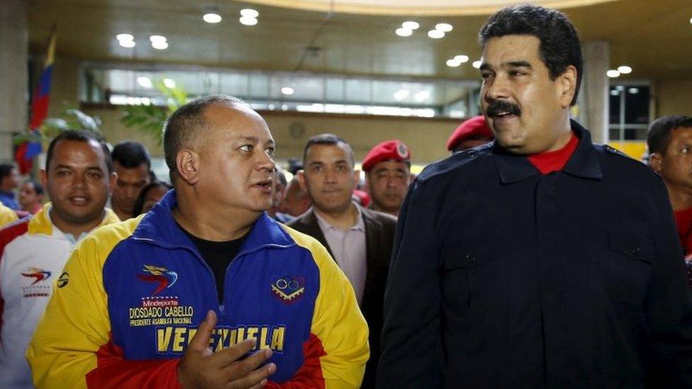 Nicolas Maduro (right) speaks to the President of the National Assembly Diosdado Cabello, after a ceremony at the National Electoral Council headquarters in Caracas on 26 October , 2015