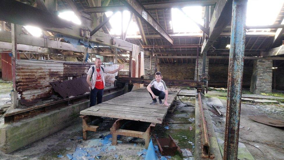 Owen and his dad Dylan Wyn Jones inside the mill