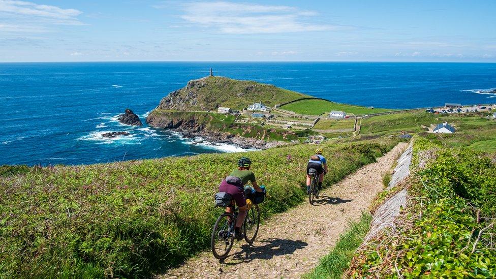 Cyclists riding along the West Cornwall coast