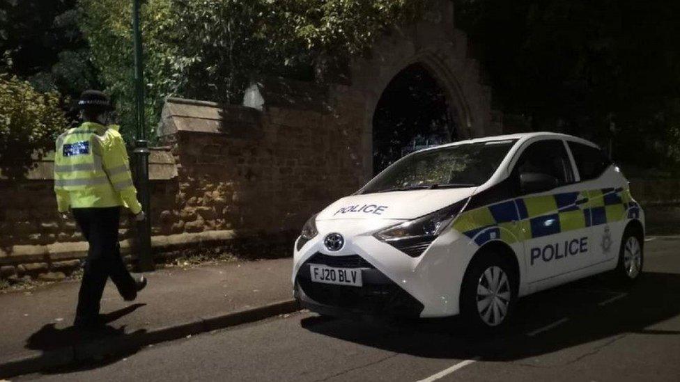 Police officer and police car