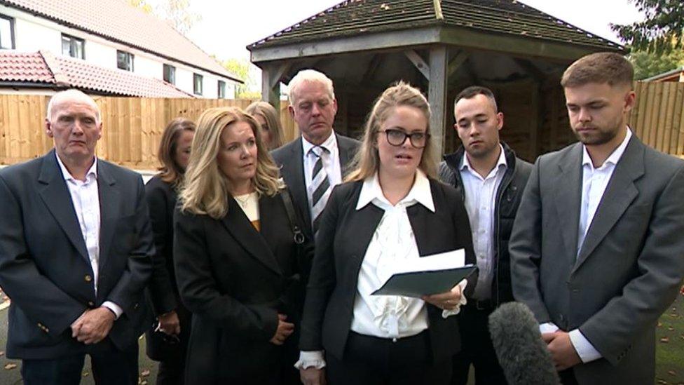 A family reading a statement