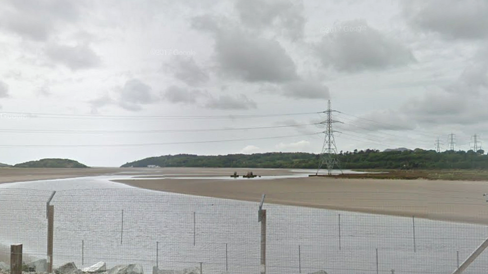 Pylon on the Dwyryd estuary with the rail line in the foreground