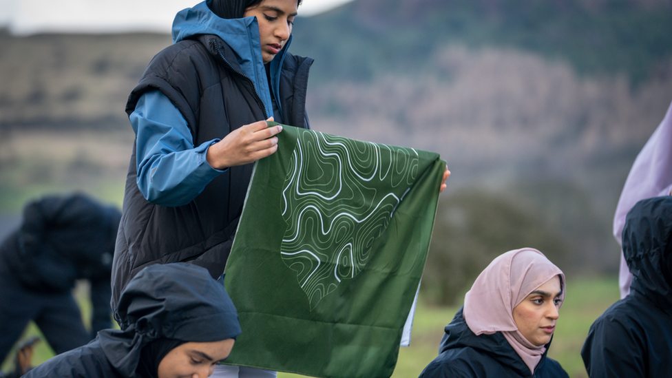 Muslim hikers prayer mats