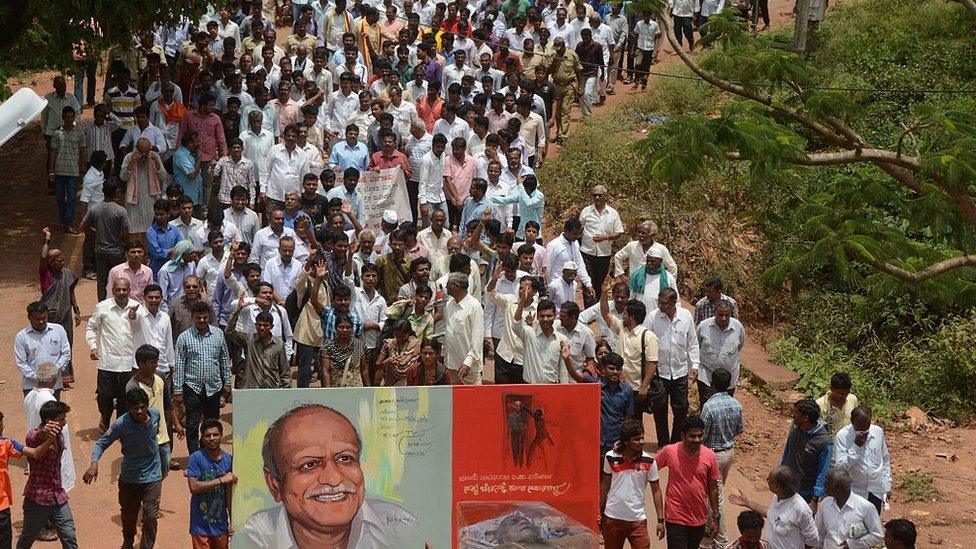 Indian mourners follow the funeral procession for scholar M.M. Kalburgi as he is taken to be buried at Karnataka University in Dharwad on August 31, 2015