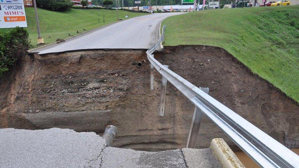 Damage to culvert crossing at Elkview Crossings Mall after heavy rain on West Virginia on 24 June