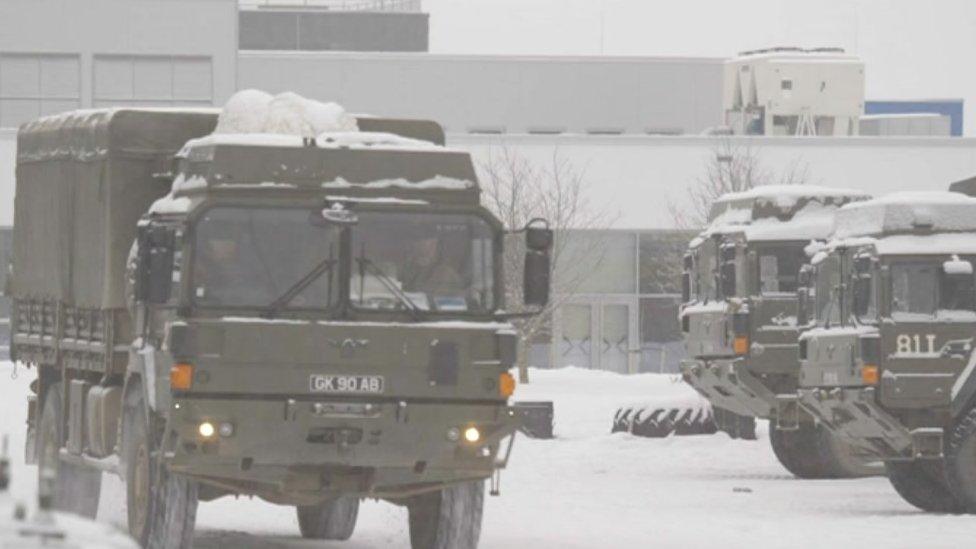 A snow covered truck leaving the base in Tapa, Estonia