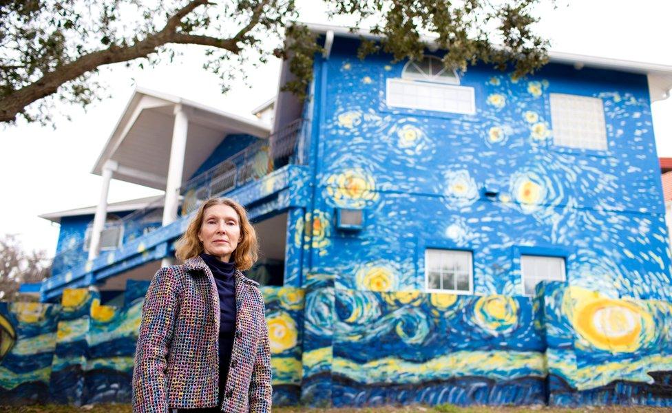 Nancy Nembhauser poses in front of the house with the Starry Night mural painted on it in Mount Dora, Florida, US, 29 January 2018