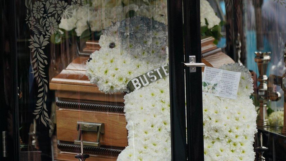 One of the floral tributes was of O'Grady's beloved dog Buster