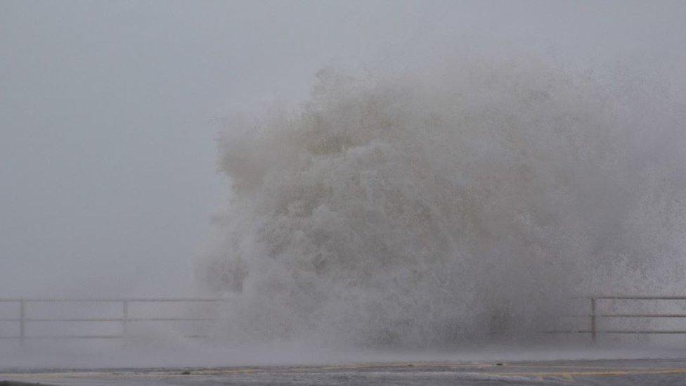 A wave crashes on to the front at Aberystwyth