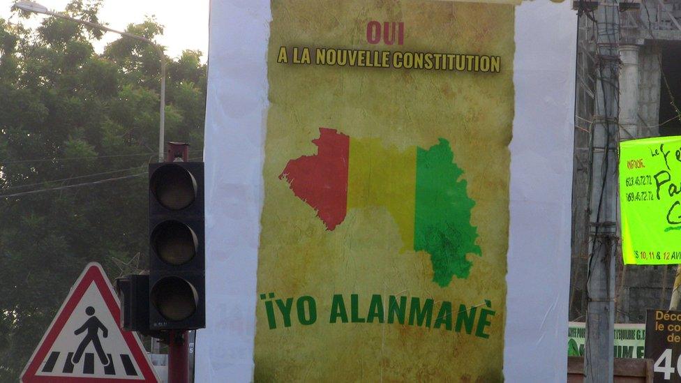 A poster urging voters in Guinea to vote "yes" in the referendum