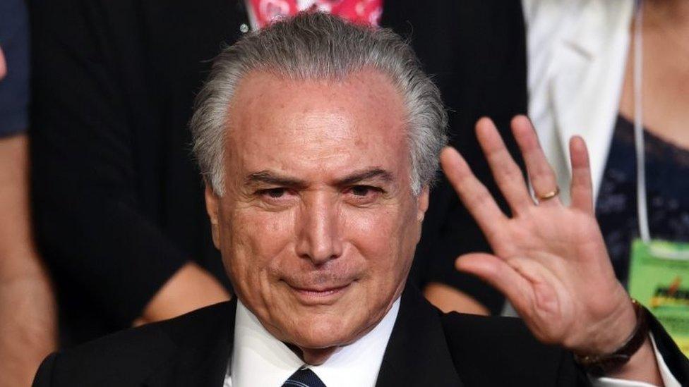 This file photo taken on March 12, 2016 shows Brazilian Vice President Michel Temer waving during the Brazilian Democratic Movement Party (PMDB) national convention in Brasilia, on March 12, 2016.