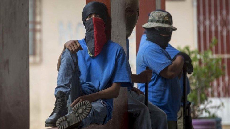 Men with covered faces guard a square in Masaya, Nicaragua, 18 July 2018, one day after the so-called "Operation Cleaning". T