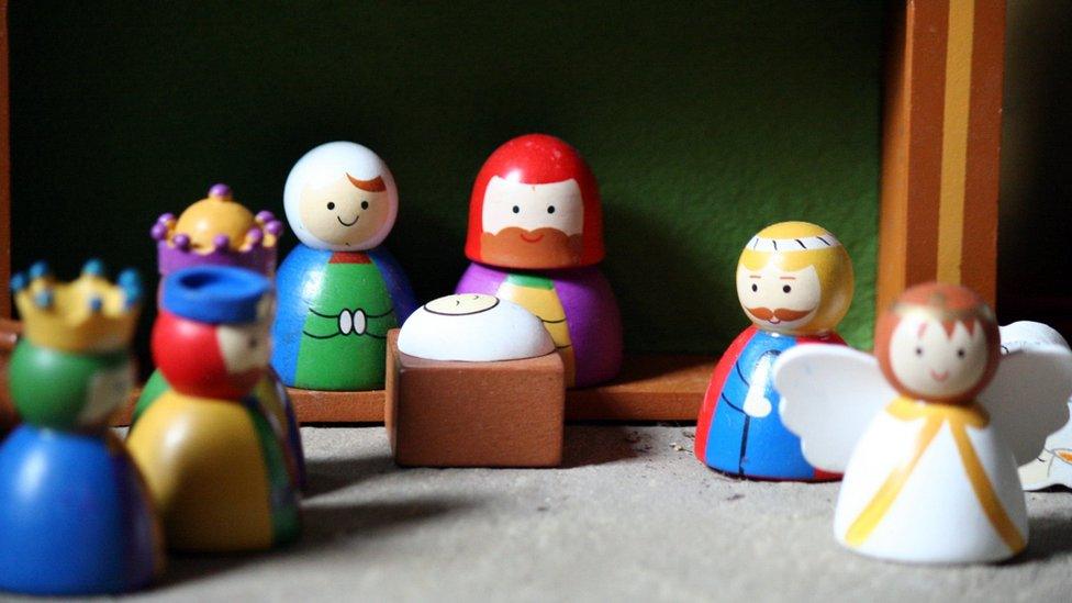 Wooden toys in a nativity scene