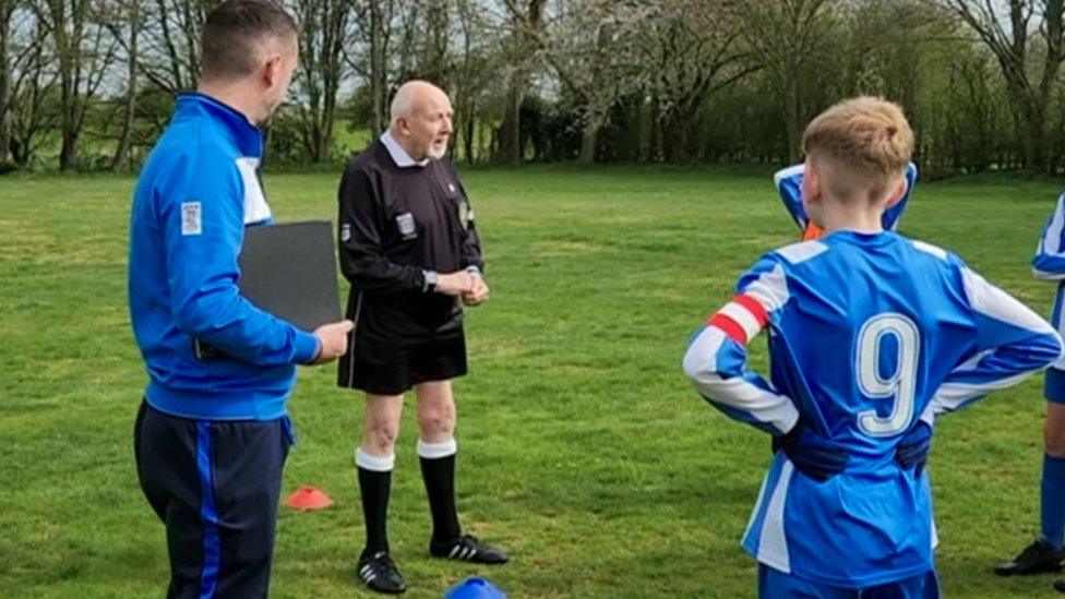 Referee Ernie Broughton sets out his expectations before kick off