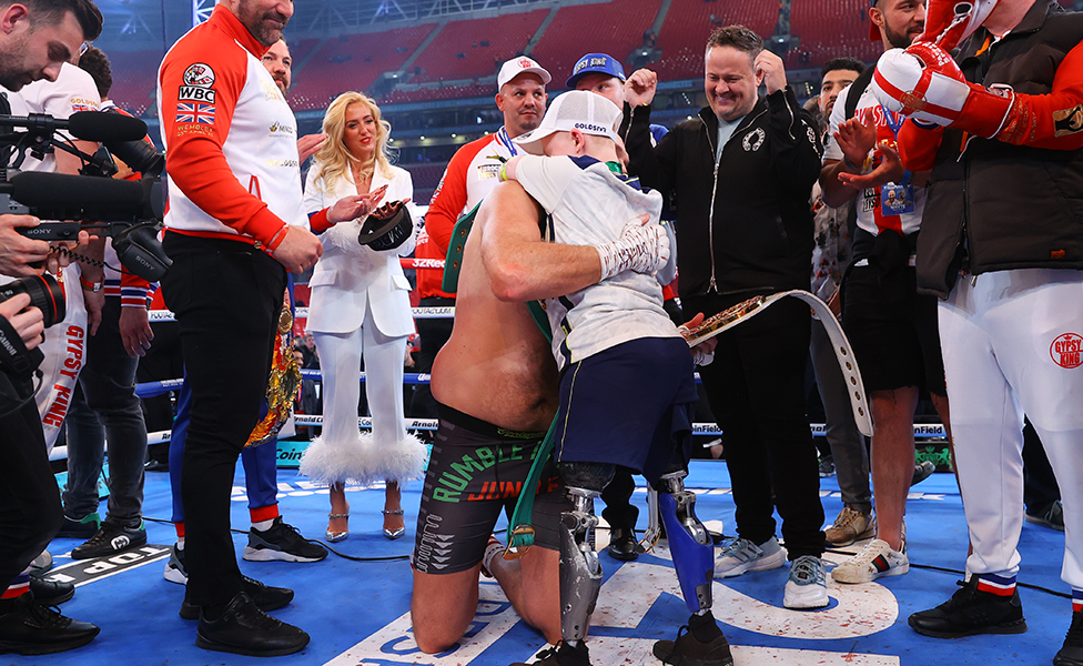 Marshall Janson hugging Tyson Fury