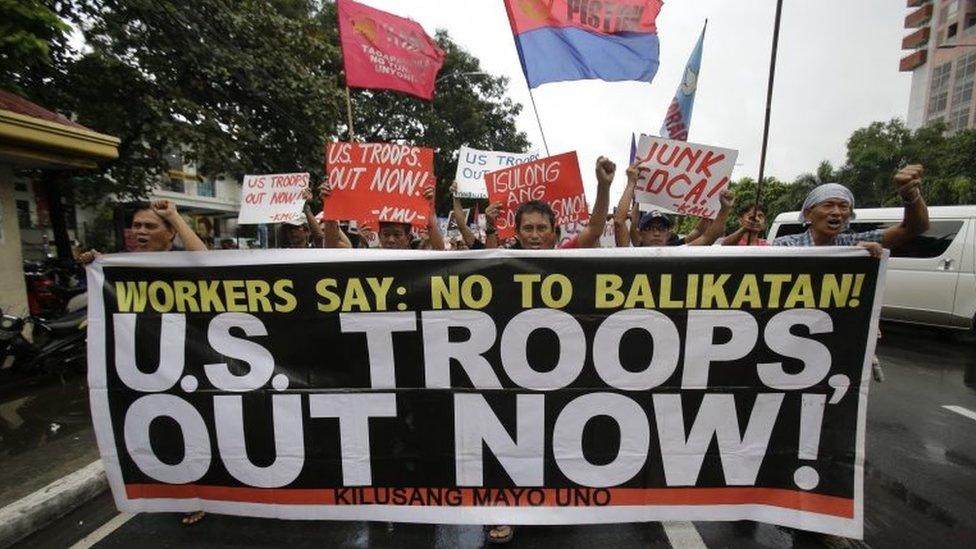 Filipino activists rally against the Enhanced Defense Cooperation Agreement (EDCA) between the U.S. and Philippines in front of the U.S. embassy in Manila, Philippines on Tuesday, Oct. 4, 2016.