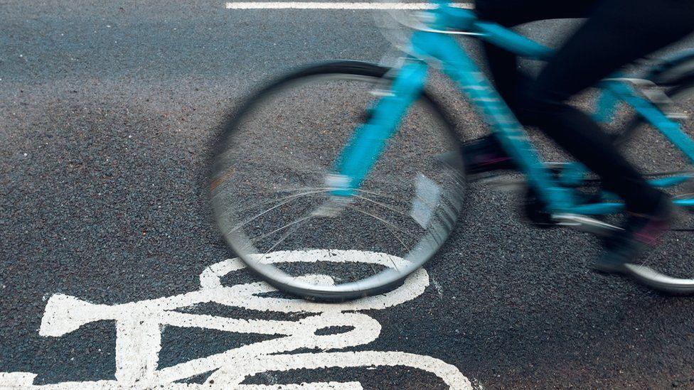 Person cycling on a cycle path