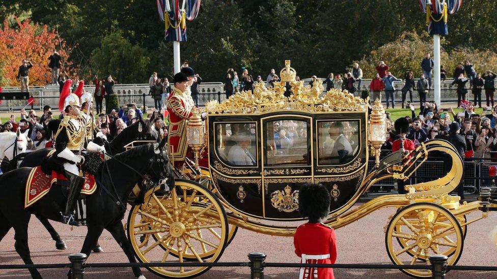The Queen and Mr Xi ride along the Mall towards Buckingham Palace in the Queen's diamond jubilee state coach.