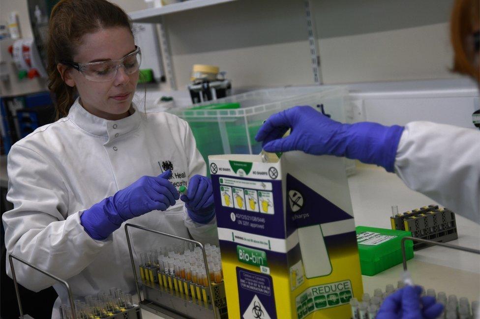 Lab technicians prepare samples at one of the new labs at the Health Security Agency, Porton Down, Salisbury