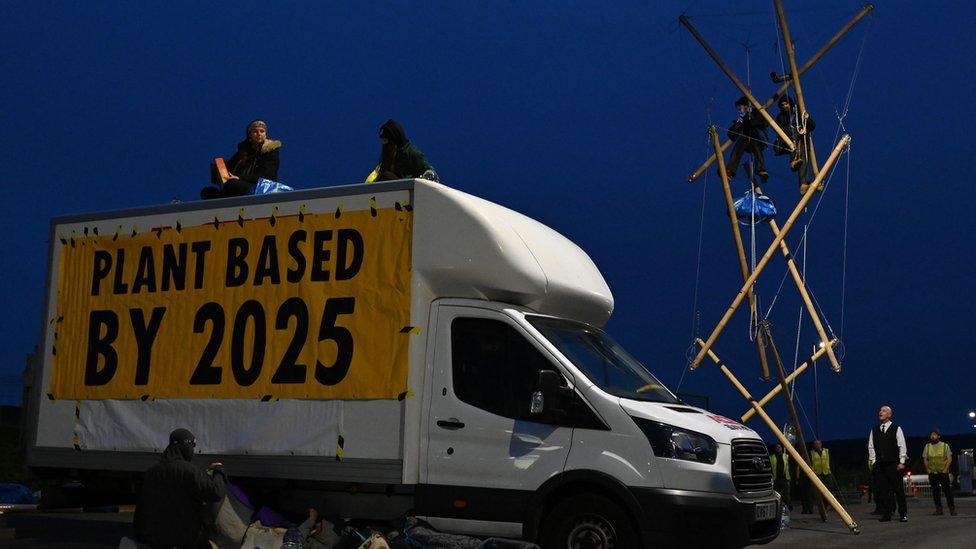 About 50 people from Animal Rebellion locked themselves on to barricades at the Arla site in Aylesbury, Buckinghamshire.