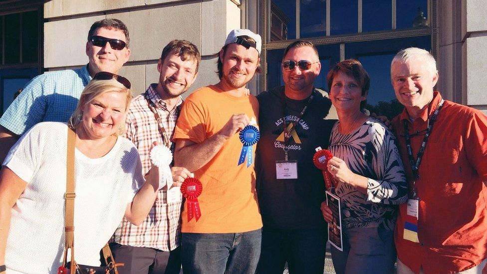 Britton Welsh, third left, with others at 'cheese camp' holding their awards