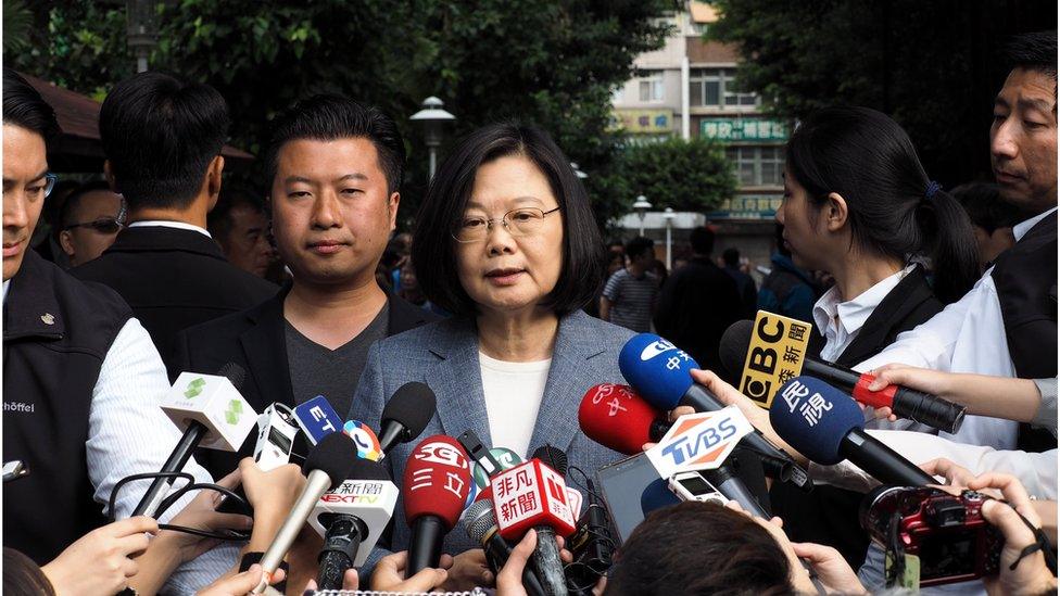 President Tsai Ing-wen speaks to reporters after casting her vote