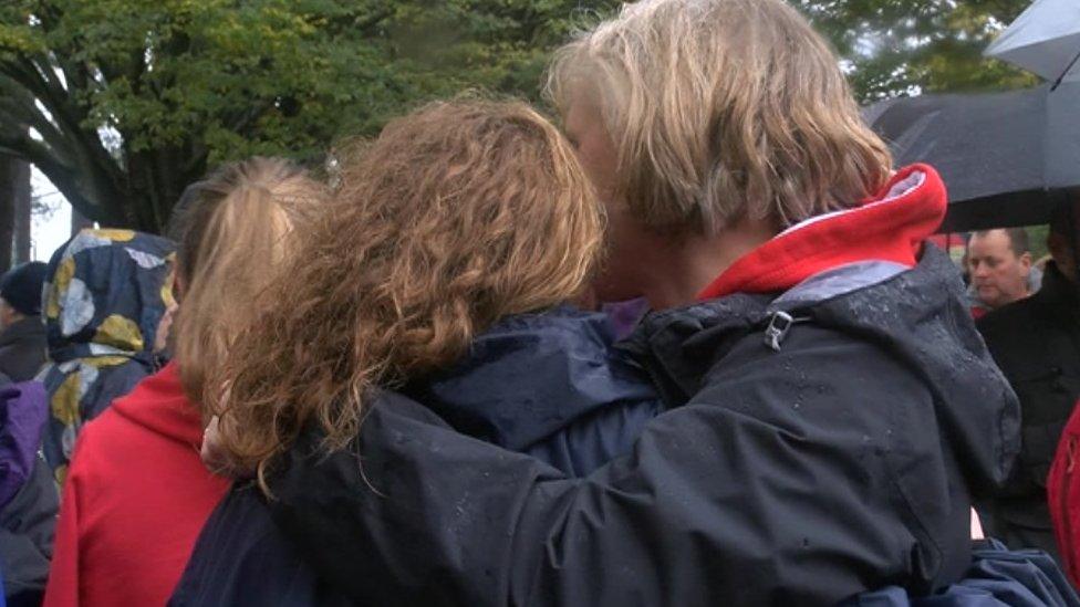 People hugging at the minute's silence