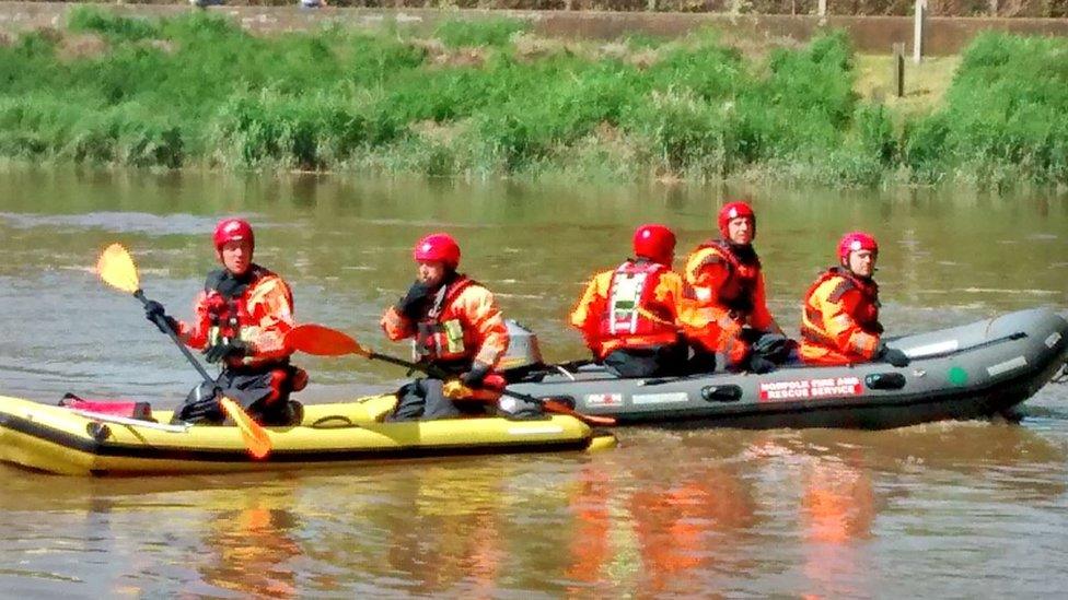 Firefighters in boats