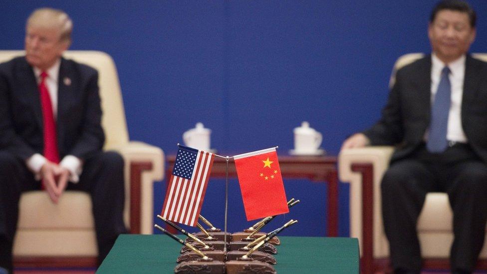 US President Donald Trump (L) and China's President Xi Jinping attend a business leaders' event inside the Great Hall of the People in Beijing on 9 November 2017