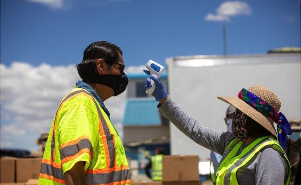 Navajo Nation President Jonathan Nez has his temperature checked