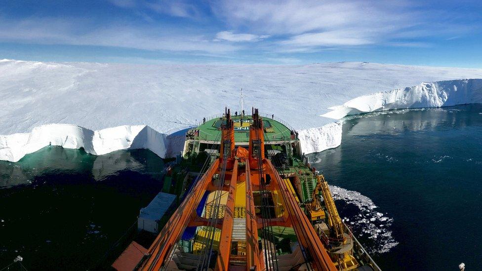 A boat with ice behind it