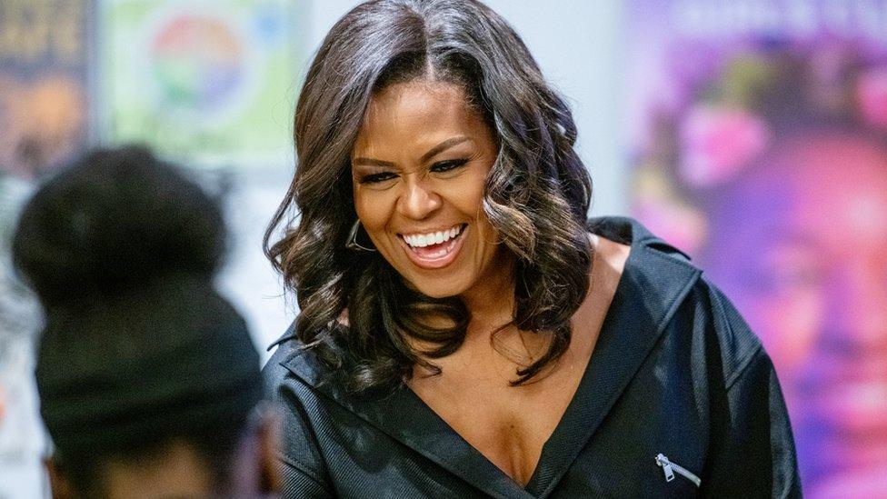 Michelle Obama smiles at a meet and greet with young girls