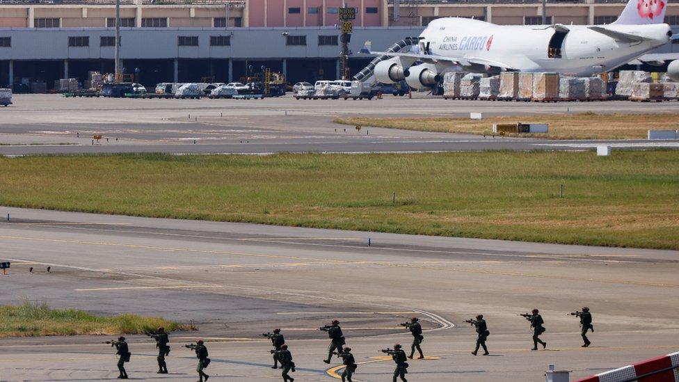 Soldiers rehearse an anti-airborne exercise for the annual Han Kuang military exercise at Taoyuan International Airport in Taoyuan, Taiwan on 19 July 2023.